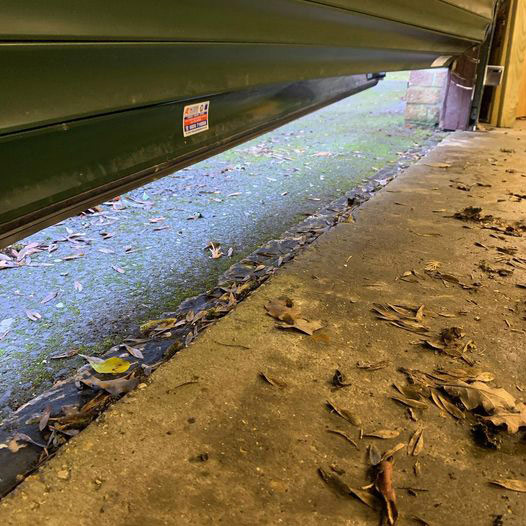 Garage Door Repairs - twisted roller shutter panel section