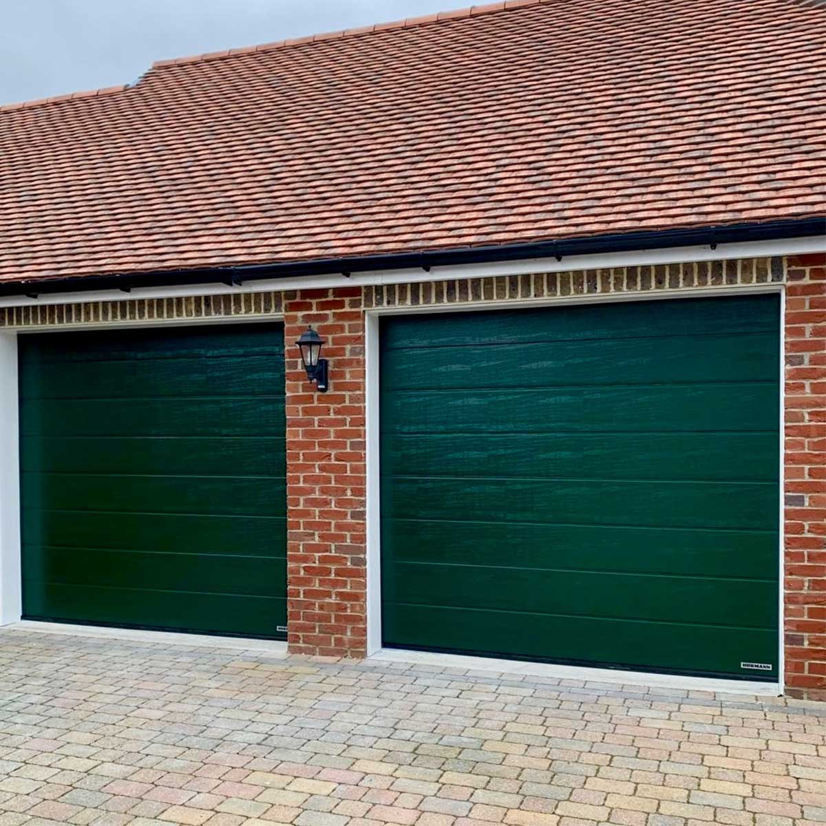 Hormann LPU42 Sectional Garage Doors in Woodgrain Fir Green